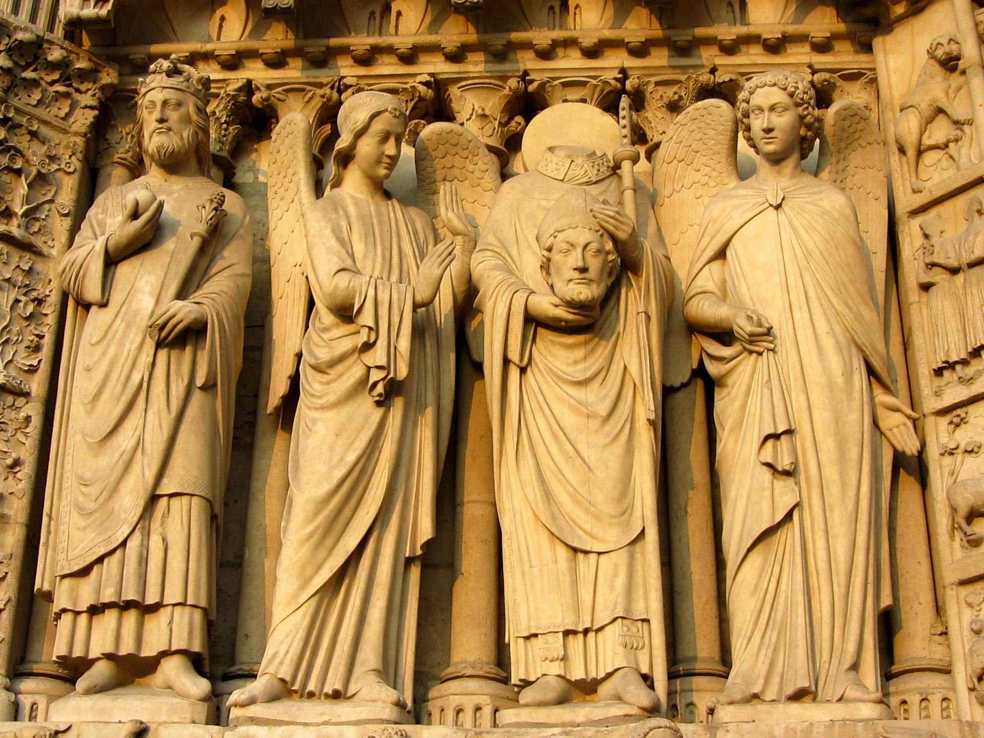 Detailed medieval stone carvings at Notre Dame Cathedral in Paris.